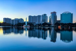 Orlando city skyline across water during daytime
