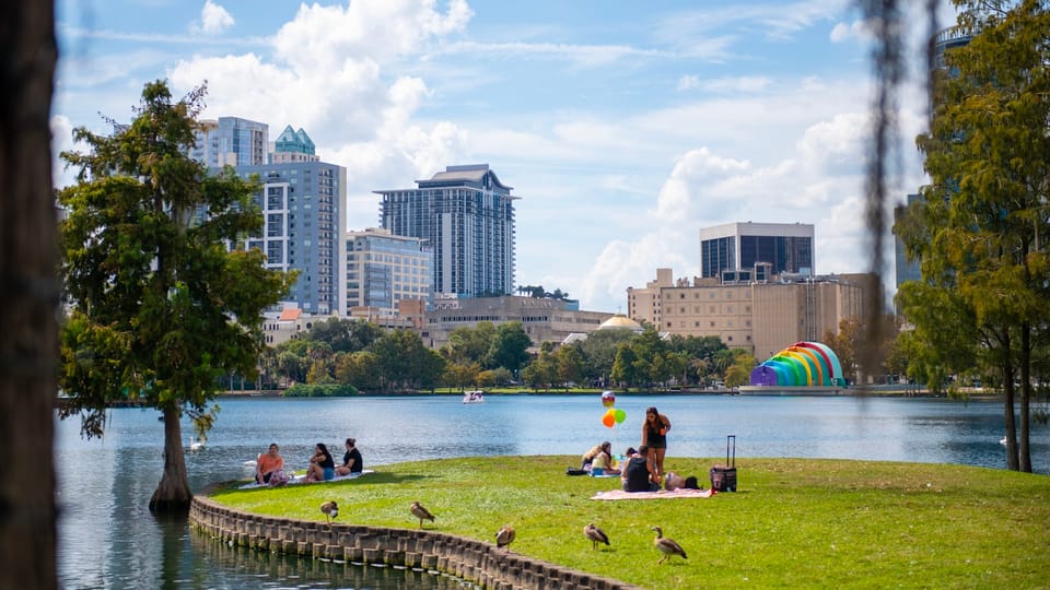 Orlando lakefront skyline with apartments and palm trees